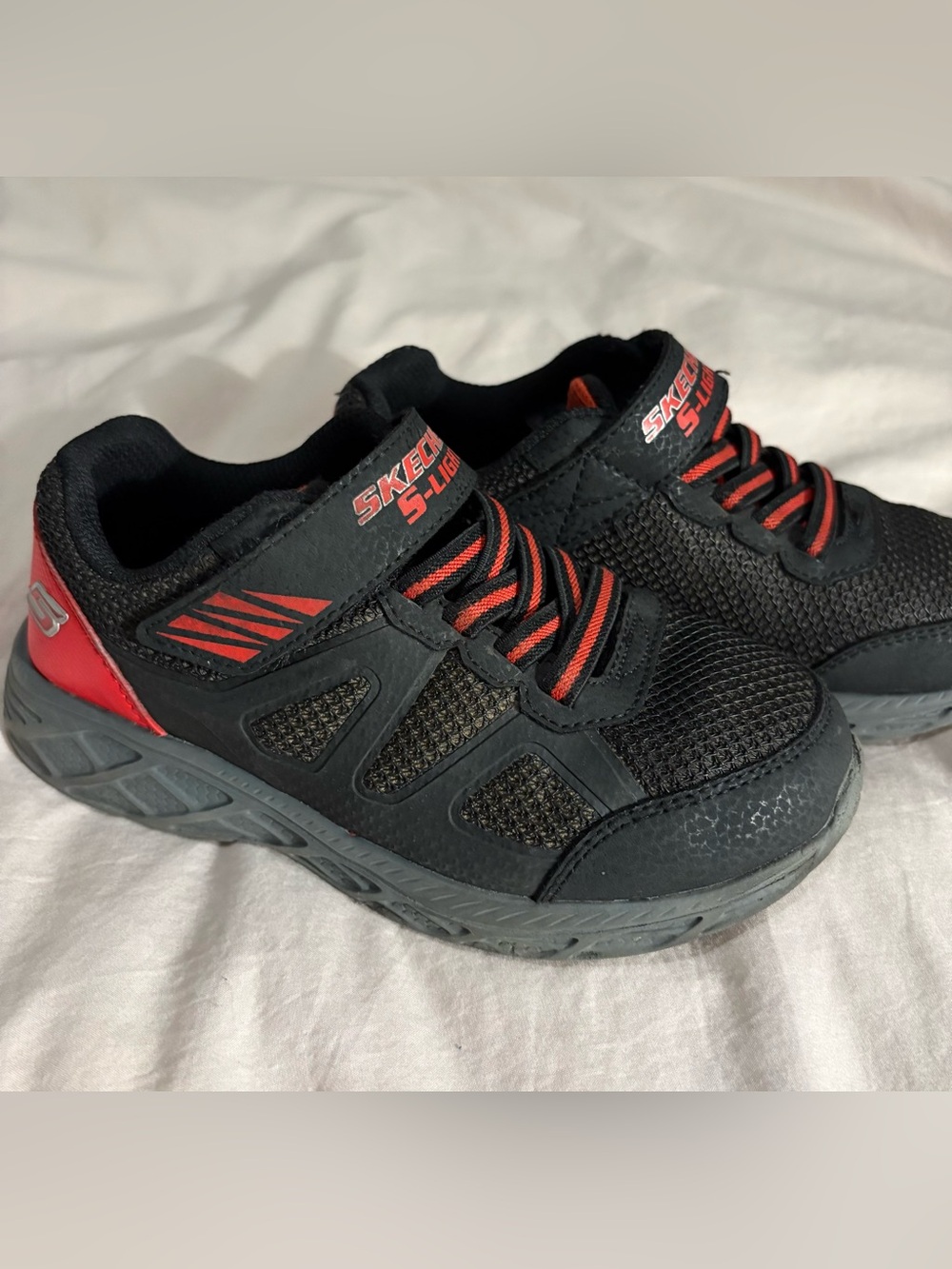 Sketchers S Light Up Sneakers with Red Accents and Blue Lights
